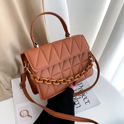 Chic Checkmate: Chain-Embellished Crossbody