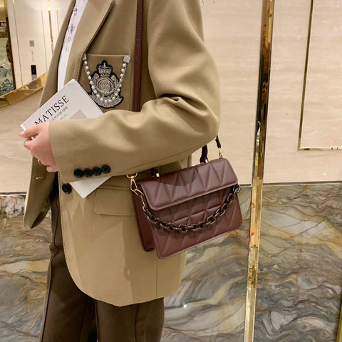 Chic Checkmate: Chain-Embellished Crossbody
